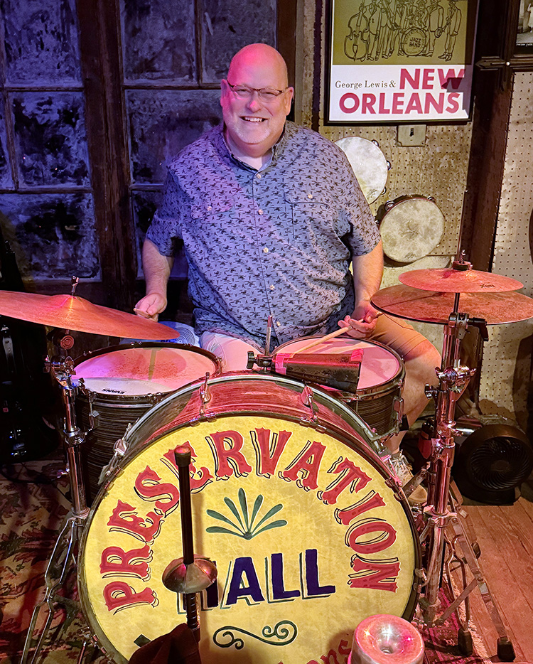 NETA VP Tim Eernisse sitting at the drum set in Preservation Hall in New Orleans